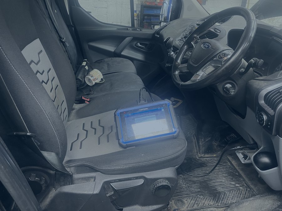Diagnostic tablet plugged into a vehicle for fault finding at R. Taylor Workshop